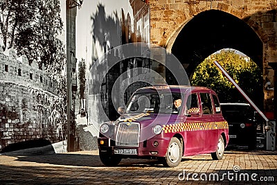 Azerbaijan, Baku - October 2016: The driver at the wheel of a taxi on the streets of the old town Editorial Stock Photo