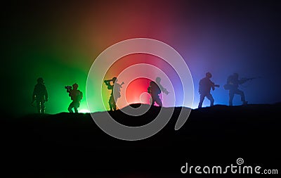 Azeri army concept. Silhouette of armed soldiers against Azerbaijani flag. Creative artwork decoration. Military silhouettes Stock Photo