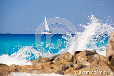 Azure coast of Calabria with sailboats on open sea in Vibo Valentia, Calabria, Southern Italy Stock Photo