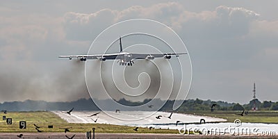 B52 bomber over runway Stock Photo