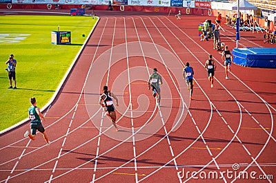 Men's 400m Race Unfolds in Captivating Evening Glow at Track and Field Contest for Worlds i Editorial Stock Photo