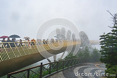 Ba Na Hills Resort, Danang, Vietnam - January 10, 2023: Many tourists on the Golden bridge Editorial Stock Photo