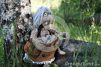 Baba yaga and her faithful grey cat Editorial Stock Photo