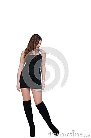 Babeface female posing in the studio dressed in black dress Stock Photo