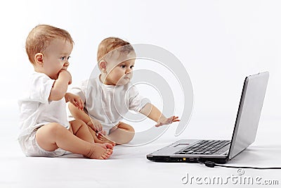 Babies with laptop Stock Photo