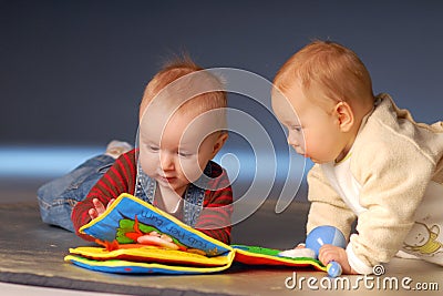 Babies with toys Stock Photo