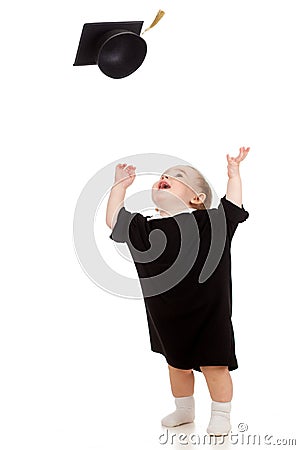 Baby in academician clothes tossing up cap Stock Photo