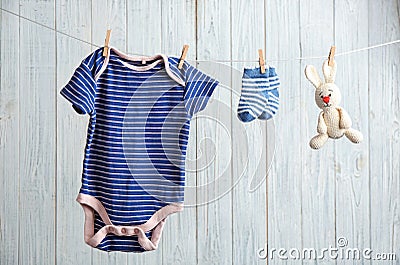 Baby accessories on laundry line Stock Photo