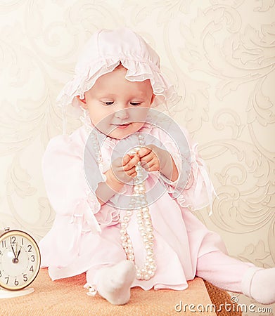 The baby around the clock on a background Stock Photo