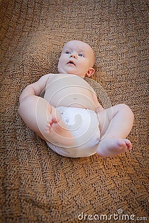 Baby On Back Wearing White Cloth Diaper Stock Photo