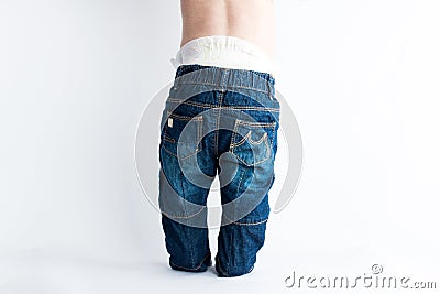 Baby in baggy jeans Stock Photo