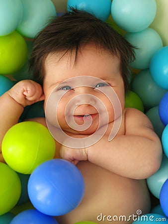 Baby in balls Stock Photo