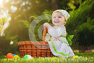 Baby in basket in the green park Stock Photo