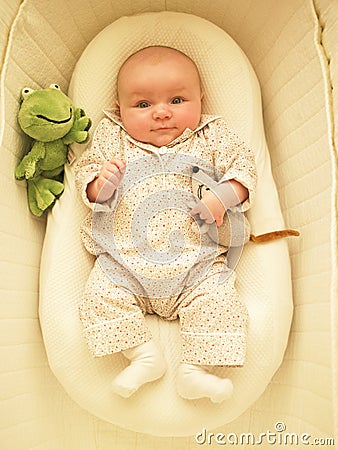 Baby in Bassinet Stock Photo