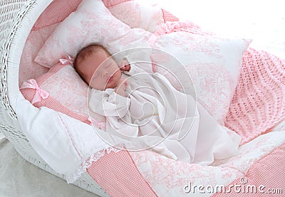 Baby in Bassinet Stock Photo