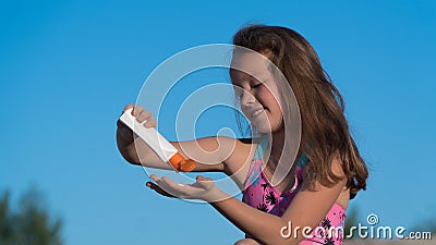 Baby on the beach. cream from sunburn. protection from the Sun Stock Photo