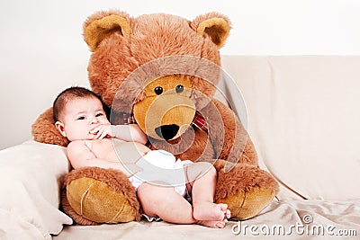 Baby with bear Stock Photo