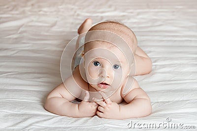 Baby on the bed Stock Photo