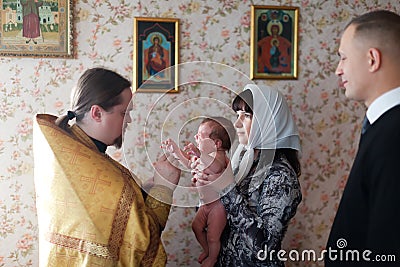Baby being baptized at Orthodox church Editorial Stock Photo