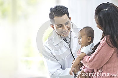 baby being checked by a doctor Stock Photo