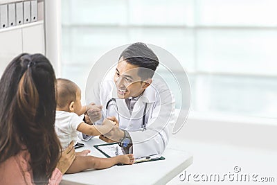 baby being checked by a doctor Stock Photo