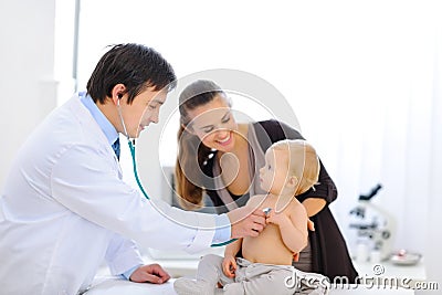 Baby being checked by doctor using stethoscope Stock Photo