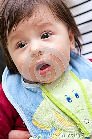 Baby with a bib Stock Photo