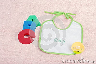 Baby bib with A B C letters Stock Photo