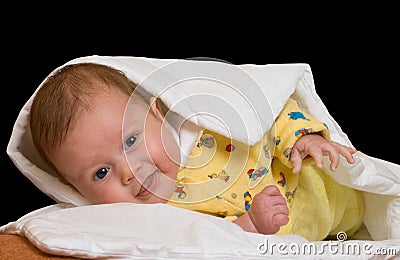 Baby on blanket over black Stock Photo