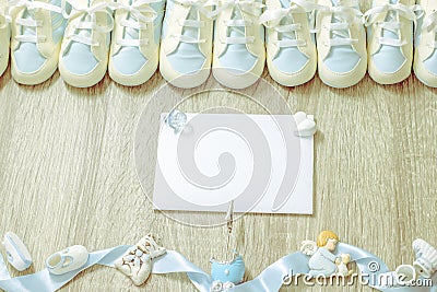 Baby booties for newborn boy shower party, store add or post card. Top view. Copy space. Framing Stock Photo