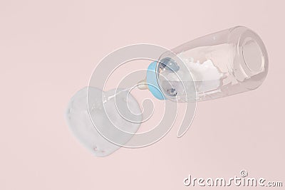 Baby bottles and heart-shaped milk on pink background. 3d illustration Stock Photo