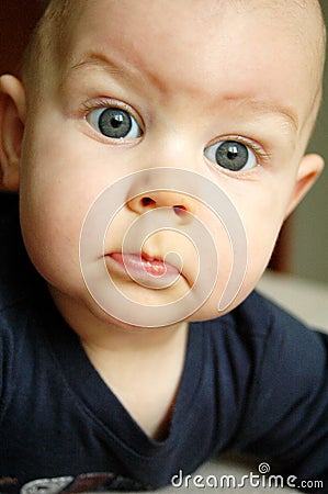 Baby boy with big blue eyse Stock Photo