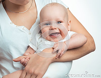 Baby boy in the comfort of moms arms Stock Photo