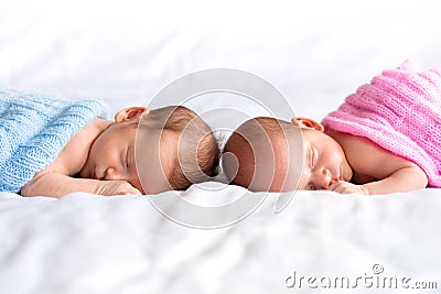 Baby boy and girl twins in bed Stock Photo