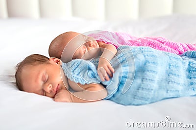 Baby boy and girl twins in bed Stock Photo