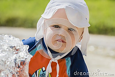 Baby Boy with Good Sun Protection on the Beach in Mexico Stock Photo