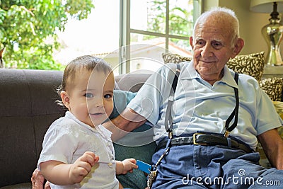 Baby boy with great grandfather Stock Photo