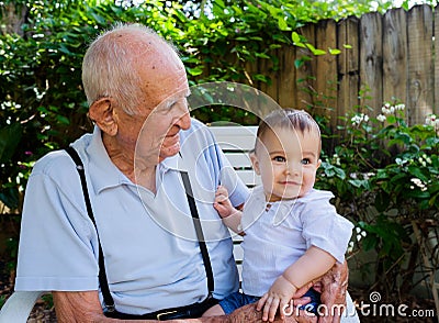 Baby boy with great grandfather Stock Photo