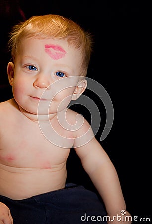 Baby boy with kiss mark Stock Photo