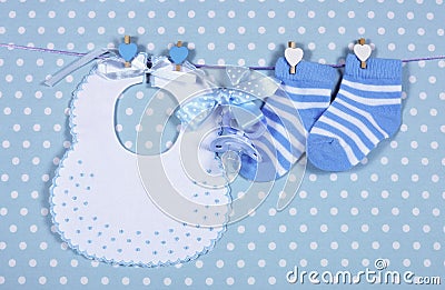 Baby boy nursery blue socks and bib Stock Photo