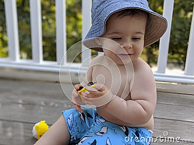 Baby boy playing in summer Stock Photo