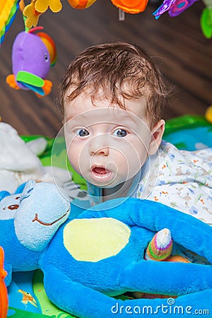 Baby boy on playmat Stock Photo