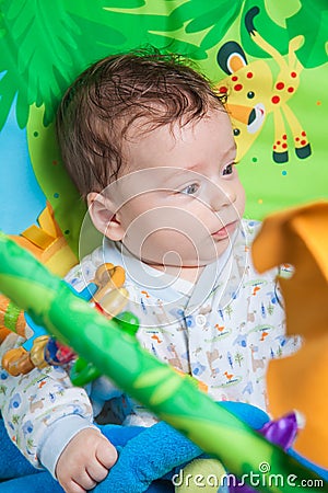 Baby boy on playmat Stock Photo