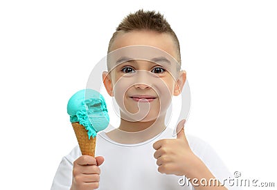 Baby boy ready for eating blue icecream in waffles cone showing Stock Photo