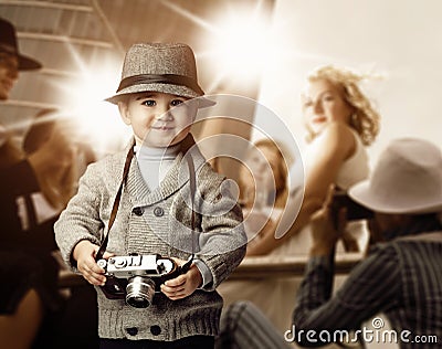 Baby boy with retro camera Stock Photo