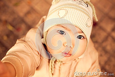 Baby boy with serious black eyes Stock Photo