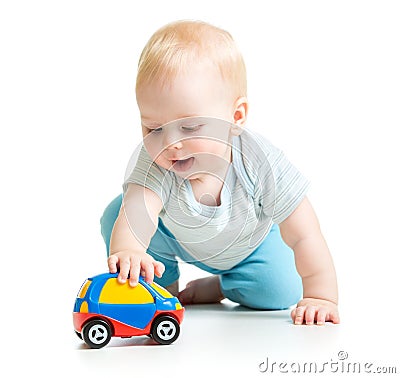 Baby boy toddler playing with toy car Stock Photo