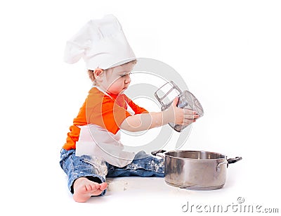 Baby chef sifting flour isolated on white background Stock Photo