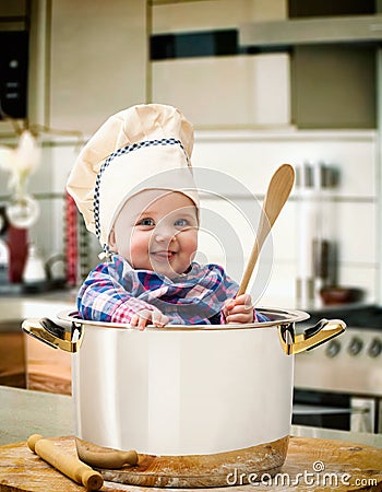 Baby chef in a steel pot Stock Photo