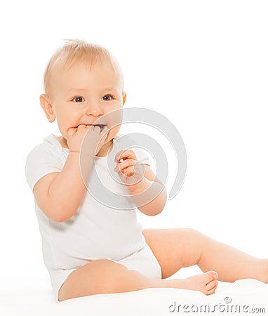 Baby chewing his fingers happy and smiling Stock Photo